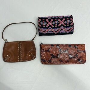 3 purses. 1 Micheal Kors wristlet, 1 express clutch, 1 clutch or crossbody
